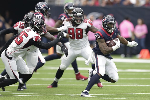 Houston Texans running back Carlos Hyde (23) runs against the Atlanta Falcons during the first half of an NFL football game Sunday, Oct. 6, 2019, in Houston. (AP Photo/Michael Wyke)