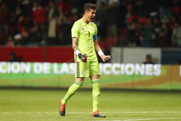 Mexico's goalkeeper Raul Gudino celebrates after his teammate Jose Juan Macias scored their first goal against Trinidad and Tobago during a friendly soccer match at Nemesio Diez Stadium in Toluca, Mexico, Wednesday, Oct. 2, 2019. (AP Photo/Eduardo Verdugo)