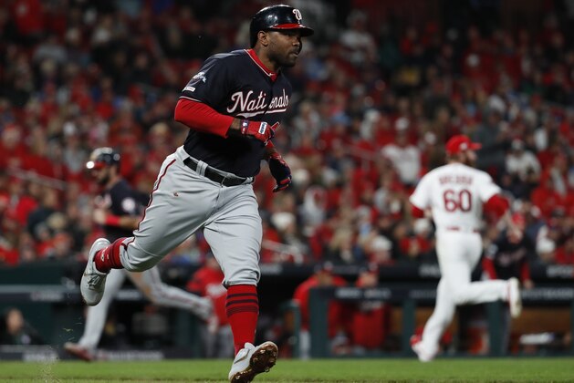 Washington Nationals' Howie Kendrick hits an RBI single during the seventh inning of Game 1 of the baseball National League Championship Series against the St. Louis Cardinals Friday, Oct. 11, 2019, in St. Louis. (AP Photo/Jeff Roberson)