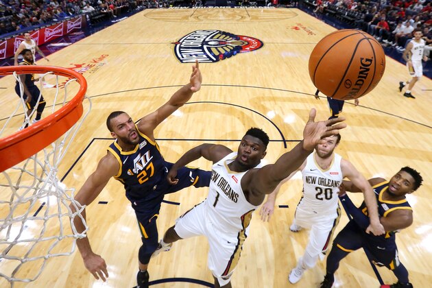 NEW ORLEANS, LOUISIANA - OCTOBER 11: Zion Williamson #1 of the New Orleans Pelicans shoots against Rudy Gobert #27 of the Utah Jazz during the second half of a game at the Smoothie King Center on October 11, 2019 in New Orleans, Louisiana. (Photo by Jonathan Bachman/Getty Images)