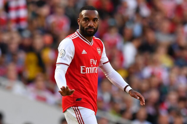 Arsenal's French striker Alexandre Lacazette gestures during the English Premier League football match between Arsenal and Tottenham Hotspur at the Emirates Stadium in London on September 1, 2019. (Photo by Ben STANSALL / AFP) / RESTRICTED TO EDITORIAL USE. No use with unauthorized audio, video, data, fixture lists, club/league logos or 'live' services. Online in-match use limited to 120 images. An additional 40 images may be used in extra time. No video emulation. Social media in-match use limited to 120 images. An additional 40 images may be used in extra time. No use in betting publications, games or single club/league/player publications. /         (Photo credit should read BEN STANSALL/AFP/Getty Images)