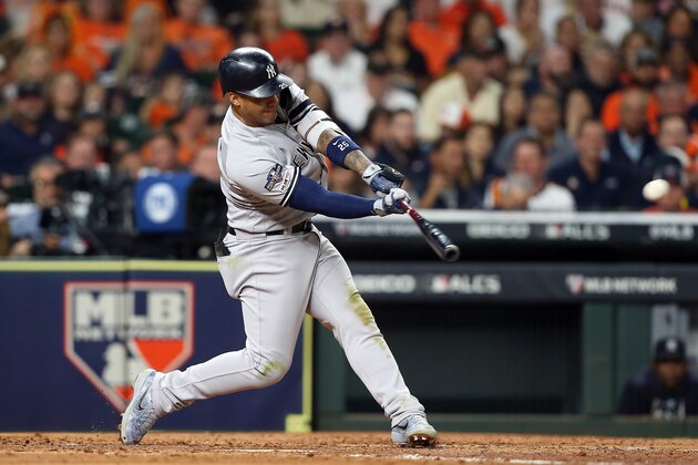 HOUSTON, TEXAS - OCTOBER 12:  Gleyber Torres #25 of the New York Yankees hits an RBI double against the Houston Astros during the fourth inning in game one of the American League Championship Series at Minute Maid Park on October 12, 2019 in Houston, Texas. (Photo by Bob Levey/Getty Images)