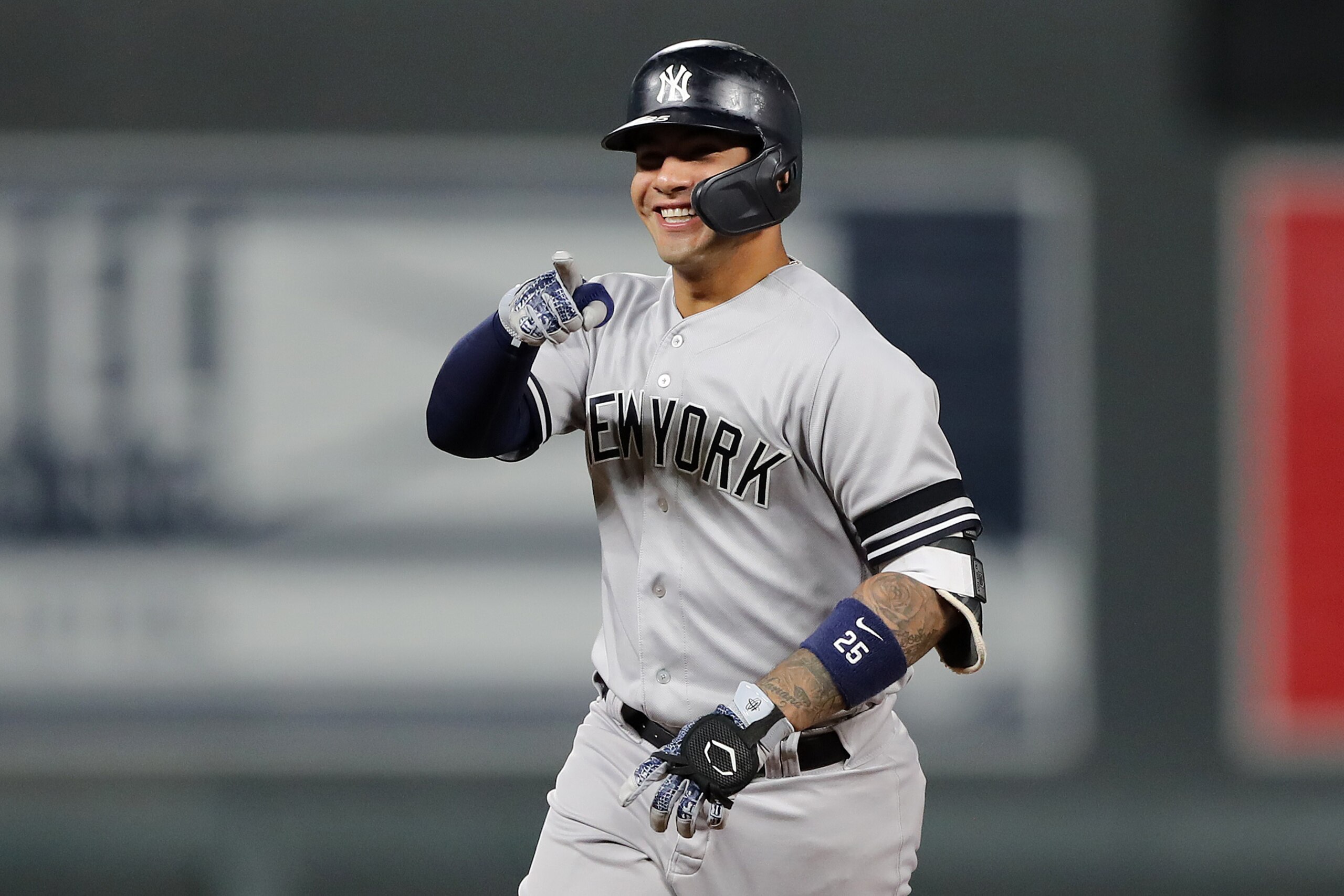 MINNEAPOLIS, MINNESOTA - OCTOBER 07: Gleyber Torres #25 of the New York Yankees celebrates after his solo home run off Jake Odorizzi #12 of the Minnesota Twins in the second inning in game three of the American League Division Series at Target Field on October 07, 2019 in Minneapolis, Minnesota. (Photo by Elsa/Getty Images)