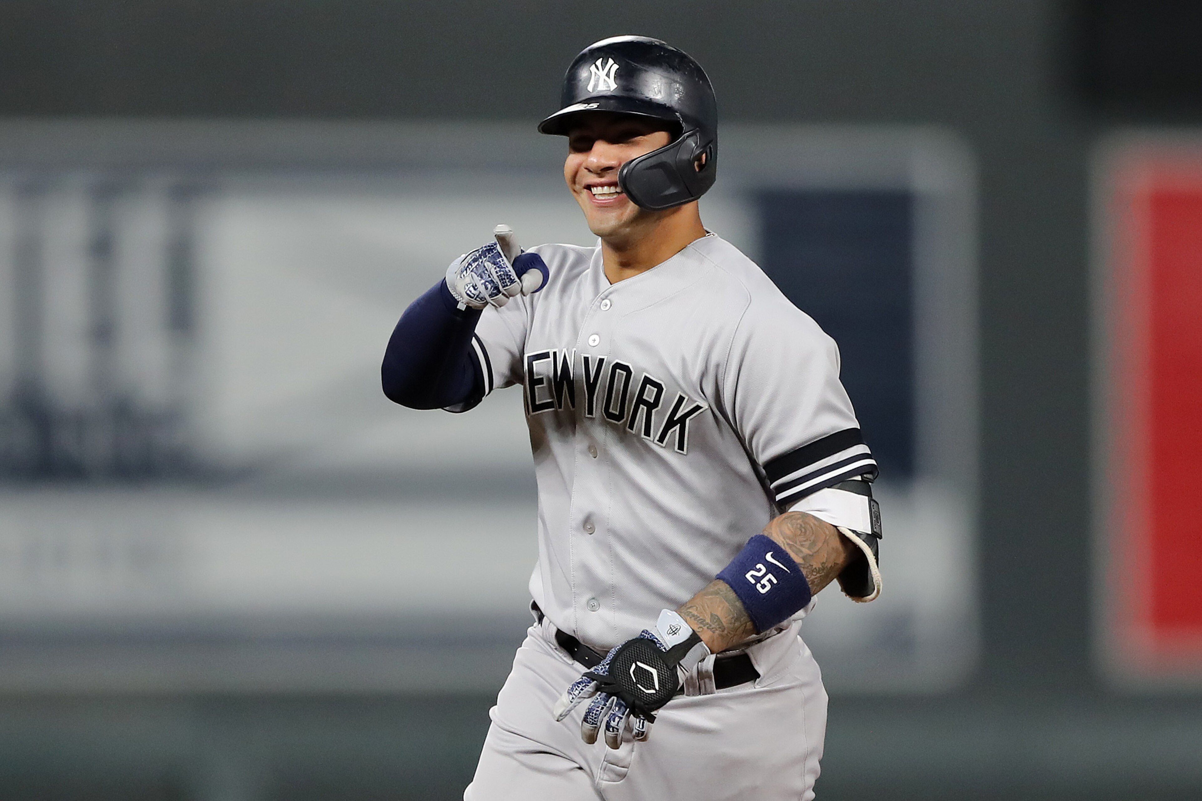 MINNEAPOLIS, MINNESOTA - OCTOBER 07: Gleyber Torres #25 of the New York Yankees celebrates after his solo home run off Jake Odorizzi #12 of the Minnesota Twins in the second inning in game three of the American League Division Series at Target Field on October 07, 2019 in Minneapolis, Minnesota. (Photo by Elsa/Getty Images)