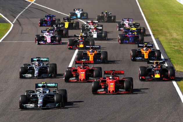 SUZUKA, JAPAN - OCTOBER 13: Valtteri Bottas driving the (77) Mercedes AMG Petronas F1 Team Mercedes W10 leads Sebastian Vettel of Germany driving the (5) Scuderia Ferrari SF90 and the rest of the field into turn one at the start during the F1 Grand Prix of Japan at Suzuka Circuit on October 13, 2019 in Suzuka, Japan. (Photo by Mark Thompson/Getty Images)