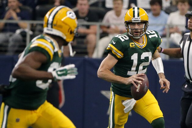 Green Bay Packers quarterback Aaron Rodgers (12) looks to throw a pass in the first half of an NFL football game against the Dallas Cowboys in Arlington, Texas, Sunday, Oct. 6, 2019. (AP Photo/Michael Ainsworth)
