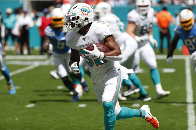 Miami Dolphins running back Kenyan Drake (32) runs the ball, during the first half at an NFL football game against the Los Angeles Chargers, Sunday, Sept. 29, 2019, in Miami Gardens, Fla. AP Photo/Wilfredo Lee)