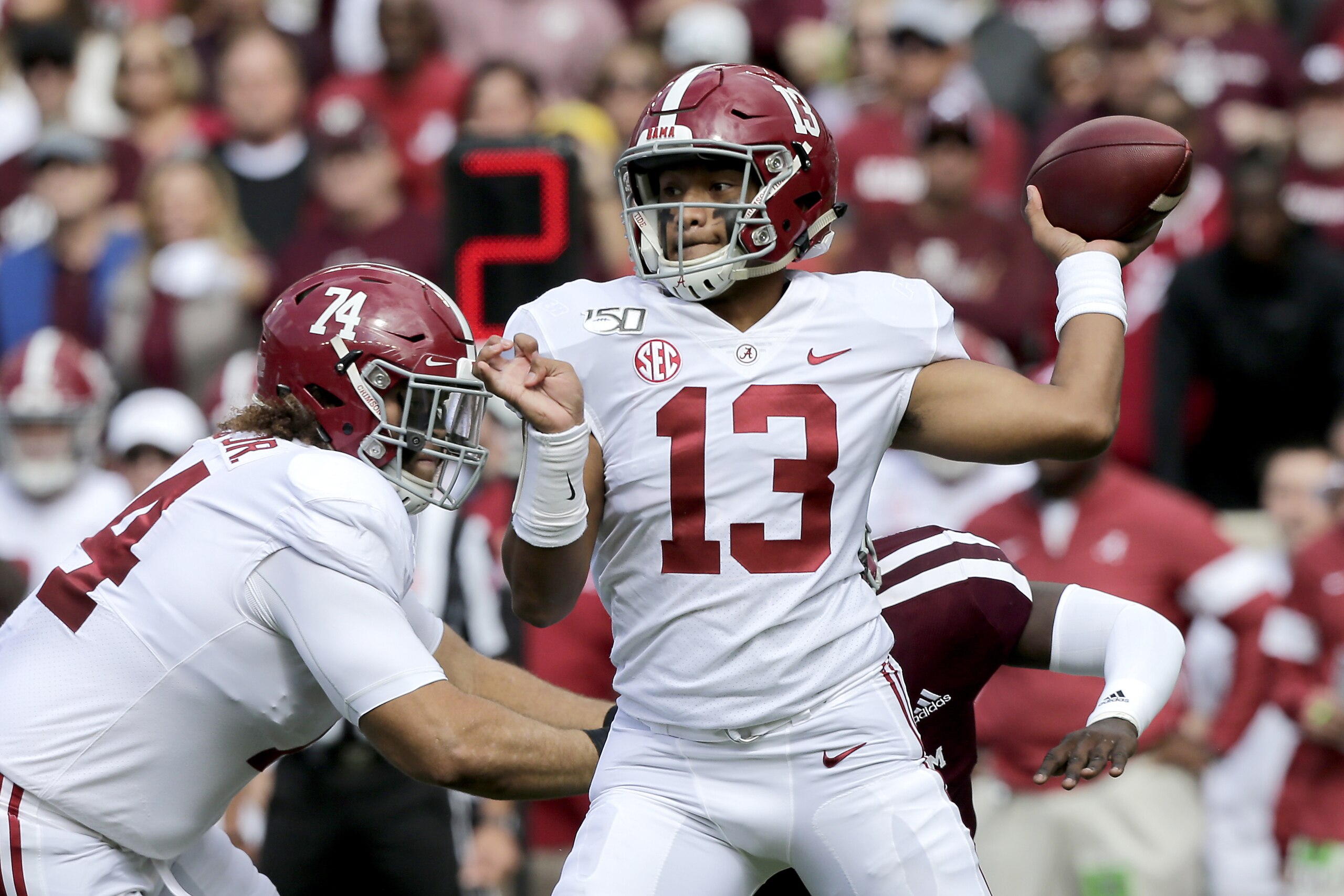 Alabama quarterback Tua Tagovailoa (13) looks to pass against Texas A&M, during the first half of an NCAA college football game, Saturday, Oct. 12, 2019, in College Station, Texas. (AP Photo/Sam Craft)