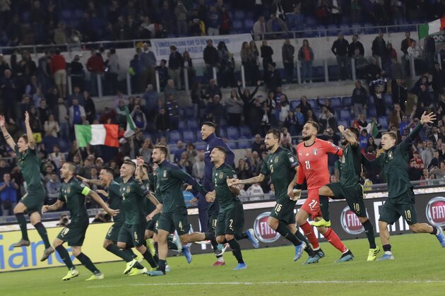 The Italian soccer team celebrates after the end of the Euro 2020 group J qualifying soccer match between Italy and Greece in Rome, Italy, Saturday, Oct. 12, 2019. Italy have qualified for Euro 2020, after defeating Greece 2-0. (AP Photo/Alessandra Tarantino)