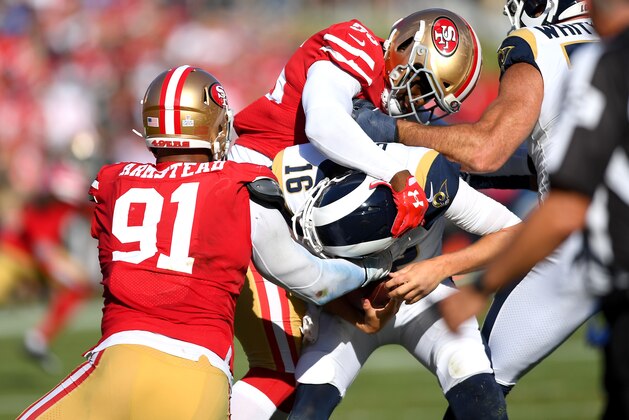 LOS ANGELES, CA - OCTOBER 13: Middle linebacker Kwon Alexander #56 and defensive end Arik Armstead #91 of the San Francisco 49ers sack quarterback Jared Goff #16 of the Los Angeles Rams in the second half at Los Angeles Memorial Coliseum on October 13, 2019 in Los Angeles, California. (Photo by Jayne Kamin-Oncea/Getty Images)