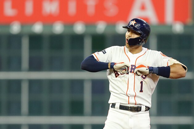 HOUSTON, TEXAS - OCTOBER 13: Carlos Correa #1 of the Houston Astros celebrates after hitting an RBI double to score Alex Bregman #2 (not pictured) during the second inning against the New York Yankees in game two of the American League Championship Series at Minute Maid Park on October 13, 2019 in Houston, Texas. (Photo by Bob Levey/Getty Images)
