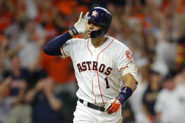 HOUSTON, TEXAS - OCTOBER 13: Carlos Correa #1 of the Houston Astros celebrates hitting a walk-off solo home run during the eleventh inning against the New York Yankees to win game two of the American League Championship Series 3-2 at Minute Maid Park on October 13, 2019 in Houston, Texas. (Photo by Bob Levey/Getty Images)