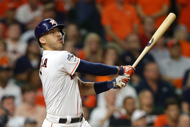 HOUSTON, TEXAS - OCTOBER 13: Carlos Correa #1 of the Houston Astros hits a walk-off solo home run during the eleventh inning against the New York Yankees to win game two of the American League Championship Series 3-2 at Minute Maid Park on October 13, 2019 in Houston, Texas. (Photo by Bob Levey/Getty Images)