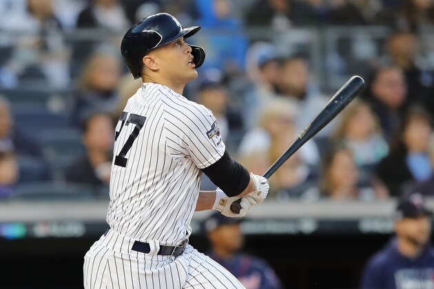 NEW YORK, NEW YORK - OCTOBER 05: Giancarlo Stanton #27 of the New York Yankees hits a sacrifice fly to score Aaron Judge #99 in the third inning of game two of the American League Division Series at Yankee Stadium on October 05, 2019 in New York City. (Photo by Elsa/Getty Images) NEW YORK, NEW YORK - OCTOBER 05: Giancarlo Stanton #27 of the New York Yankees hits a sacrifice fly to score Aaron Judge #99 in the third inning of game two of the American League Division Series at Yankee Stadium on October 05, 2019 in New York City. (Photo by Elsa/Getty Images)