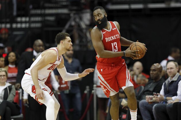 HOUSTON, TX - DECEMBER 01:  James Harden #13 of the Houston Rockets controls the ball defended by Zach LaVine #8 of the Chicago Bulls in the first half at Toyota Center on December 1, 2018 in Houston, Texas.  NOTE TO USER: User expressly acknowledges and agrees that, by downloading and or using this photograph, User is consenting to the terms and conditions of the Getty Images License Agreement.  (Photo by Tim Warner/Getty Images)