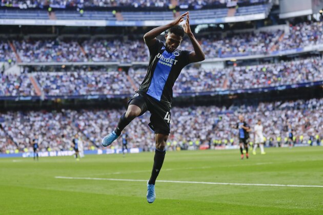 Brugge's Emmanuel Dennis celebrates after scoring his side's second goal during the Champions League group A soccer match between Real Madrid and Club Brugge, at the Santiago Bernabeu stadium in Madrid, Tuesday, Oct.1, 2019. (AP Photo/Manu Fernandez)