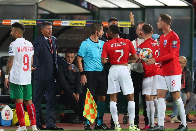 SOFIA, BULGARIA - OCTOBER 14: Raheem Sterling, Kieran Trippier and Jordan Henderson speak with Krasimir Balakov manager of Bulgaria during the UEFA Euro 2020 qualifier between Bulgaria and England on October 14, 2019 in Sofia, Bulgaria. (Photo by Catherine Ivill/Getty Images)