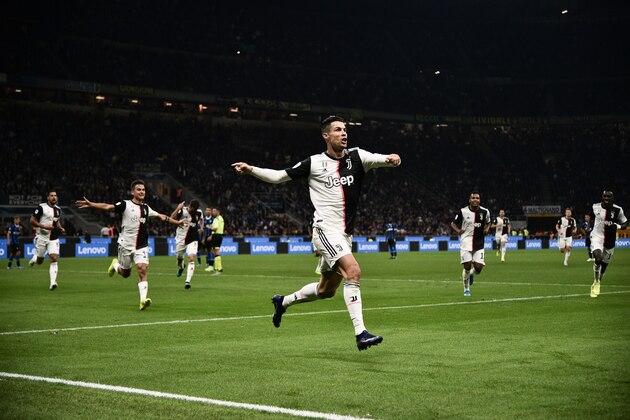 TOPSHOT - Juventus' Portuguese forward Cristiano Ronaldo celebrates after scoring a goal that was later rescinded during the Italian Serie A football match Inter vs Juventus on October 6, 2019 at the San Siro stadium in Milan. (Photo by Marco BERTORELLO / AFP) (Photo by MARCO BERTORELLO/AFP via Getty Images)