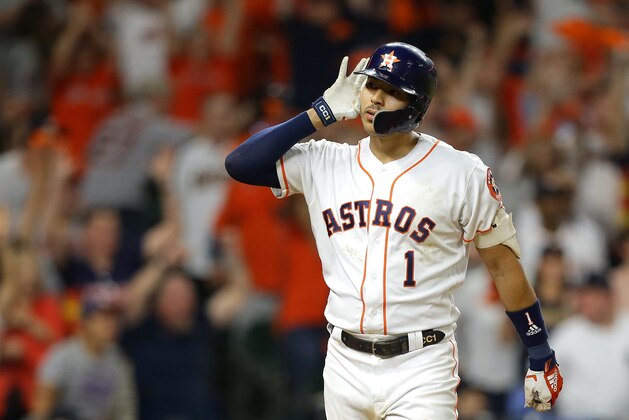 HOUSTON, TEXAS - OCTOBER 13: Carlos Correa #1 of the Houston Astros celebrates hitting a walk-off solo home run during the eleventh inning against the New York Yankees to win game two of the American League Championship Series 3-2 at Minute Maid Park on October 13, 2019 in Houston, Texas. (Photo by Bob Levey/Getty Images)