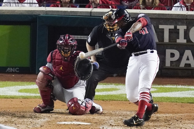 Washington Nationals' Howie Kendrick hits an RBI double during the fifth inning of Game 3 of the baseball National League Championship Series against the St. Louis Cardinals Monday, Oct. 14, 2019, in Washington. (AP Photo/Alex Brandon)