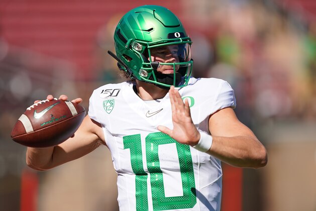 PALO ALTO, CA - SEPTEMBER 21:  Justin Herbert #10 of the Oregon Ducks warms up during pregame warm ups prior to the start of an NCAA football game against the Stanford Cardinal at Stanford Stadium on September 21, 2019 in Palo Alto, California.  (Photo by Thearon W. Henderson/Getty Images)