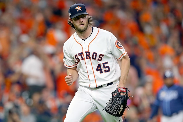 HOUSTON, TEXAS - OCTOBER 10:  Gerrit Cole #45 of the Houston Astros reacts after striking out Willy Adames (not pictured) #1 of the Tampa Bay Rays during the fifth inning in game five of the American League Division Series at Minute Maid Park on October 10, 2019 in Houston, Texas. (Photo by Bob Levey/Getty Images)