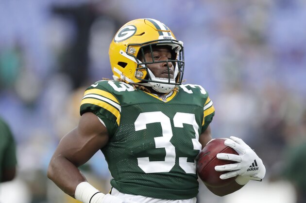 Green Bay Packers running back Aaron Jones works out prior to a NFL football preseason game against the Baltimore Ravens, Thursday, Aug. 15, 2019, in Baltimore. (AP Photo/Julio Cortez)