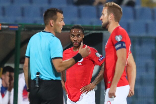 SOFIA, BULGARIA - OCTOBER 14: Raheem Sterling of England watches as captain Harry Kane speaks with referee Ivan Bebek during the UEFA Euro 2020 qualifier between Bulgaria and England on October 14, 2019 in Sofia, Bulgaria. (Photo by Catherine Ivill/Getty Images)