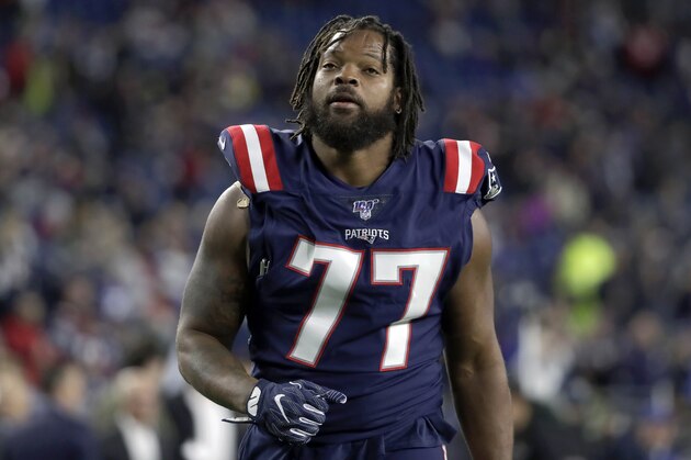 New England Patriots defensive end Michael Bennett warms up before an NFL football game against the New York Giants, Thursday, Oct. 10, 2019, in Foxborough, Mass. (AP Photo/Elise Amendola)