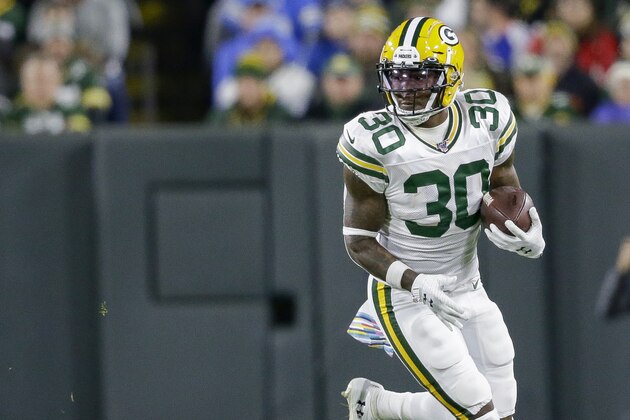 Green Bay Packers running back Jamaal Williams rushes against the Detroit Lions during the first half of an NFL football game Monday, Oct. 14, 2019, in Green Bay, Wis. (AP Photo/Jeffrey Phelps)