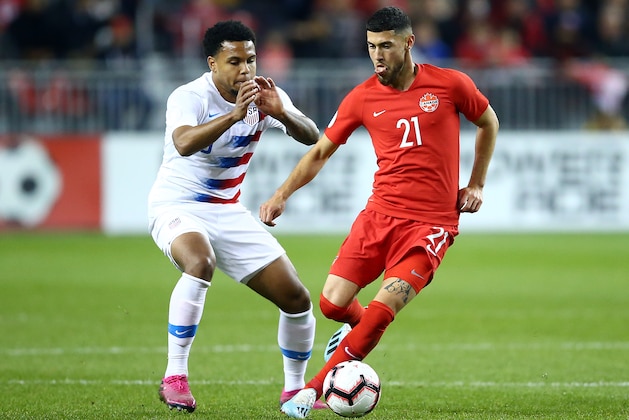 TORONTO, ON - OCTOBER 15:  Weston McKennie #8 of the United States battles Jonathan Osorio #21 of Canada for the ball during a CONCACAF Nations League game at BMO Field on October 15, 2019 in Toronto, Canada.  (Photo by Vaughn Ridley/Getty Images)