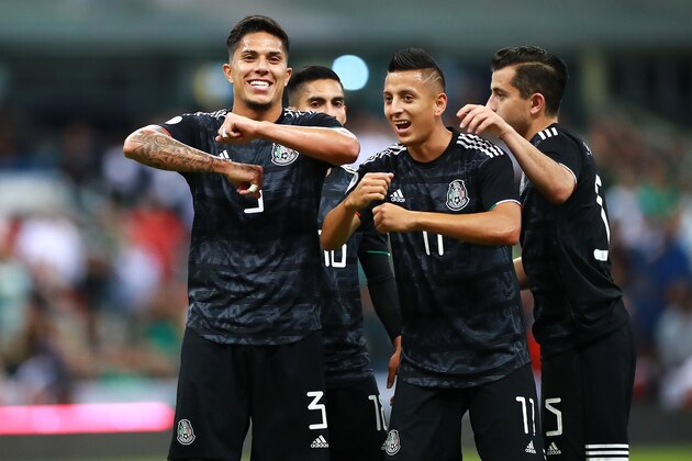 MEXICO CITY, MEXICO - OCTOBER 15: Roberto Alvarado of Mexico celebrates with teammate Carlos Salcedo after scoring the first goal of his team during the match between Mexico and Panama as part of the Concacaf Nations League at Azteca Stadium on October 15, 2019 in Mexico City, Mexico. (Photo by Hector Vivas/Getty Images)