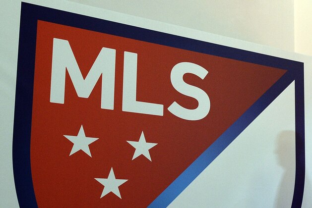 The new Major League Soccer (MLS) logo is pictured during an unveiling event in New York on September 18, 2014. MLS unveiled the new logo ahead of its 20th season. AFP PHOTO/Jewel Samad        (Photo credit should read JEWEL SAMAD/AFP/Getty Images)