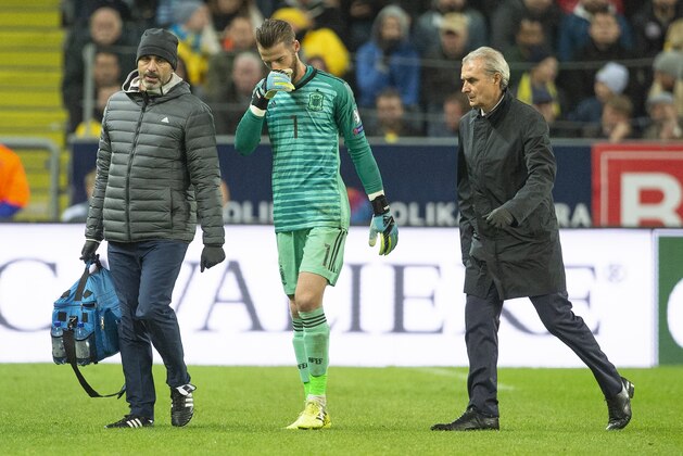 SOLNA, SWEDEN - OCTOBER 15: David de Gea of Spain walks from the pitch with Spain medical staff after picking up an injury during the UEFA Euro 2020 qualifier between Sweden and Spain at Friends arena on October 15, 2019 in Solna, Sweden. (Photo by Visionhaus)