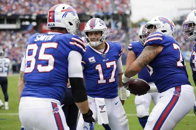 Buffalo Bills quarterback Josh Allen (17) celebrates with tight end Lee Smith (85) after they teamed up for an 8-yard touchdown pass against the Tennessee Titans in the first half of an NFL football game Sunday, Oct. 6, 2019, in Nashville, Tenn. (AP Photo/James Kenney)