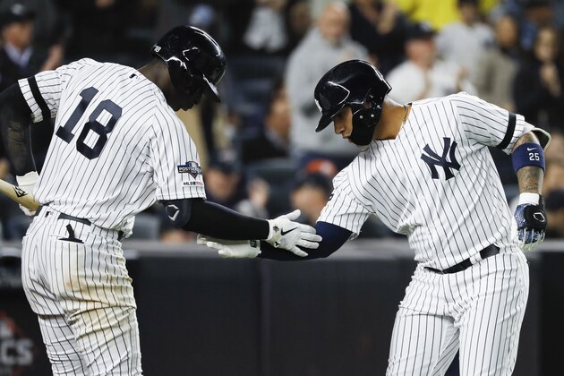 New York Yankees' Gleyber Torres, right, celebrates his home run with Didi Gregorius against the Houston Astros during the eighth inning in Game 3 of baseball's American League Championship Series Tuesday, Oct. 15, 2019, in New York. (AP Photo/Matt Slocum)