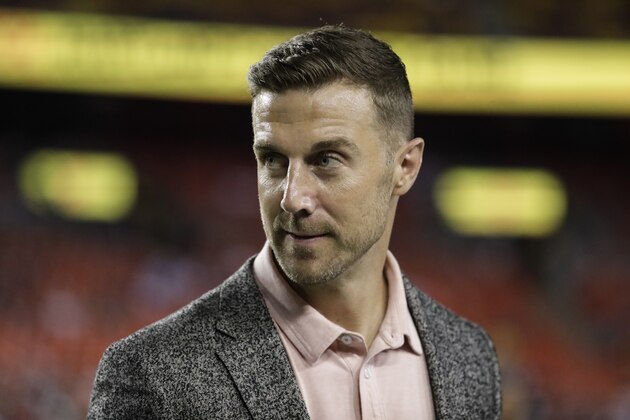 Washington Redskins quarterback Alex Smith stands on the field before an NFL football game against the Chicago Bears, Monday, Sept. 23, 2019, in Landover, Md. (AP Photo/Julio Cortez)