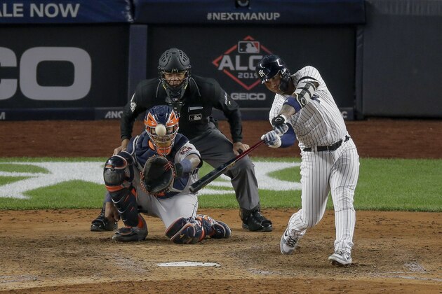 New York Yankees' Gleyber Torres connects for a solo home run against the Houston Astros during the eighth inning of Game 3 of baseball's American League Championship Series, Tuesday, Oct. 15, 2019, in New York. (AP Photo/Seth Wenig)