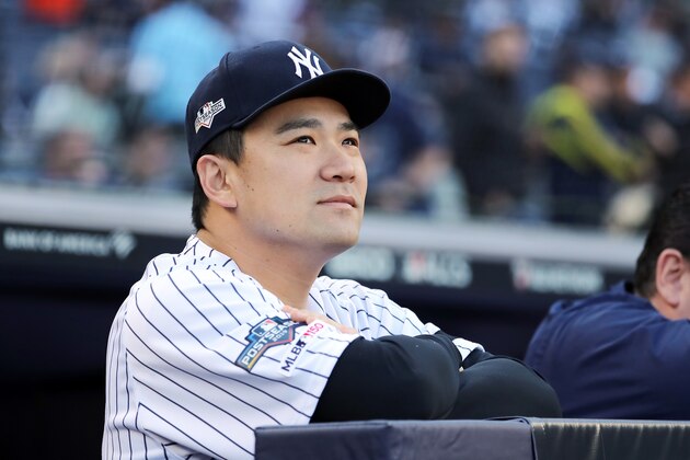 NEW YORK, NEW YORK - OCTOBER 15: Masahiro Tanaka #19 of the New York Yankees looks on from the dugout before game three of the American League Championship Series against the Houston Astros at Yankee Stadium on October 15, 2019 in New York City. (Photo by Elsa/Getty Images)