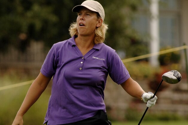 Lee Ann Walker-Cooper watches the ball from the ninth tee during the rain delayed first round of the LPGA Tour's NW Arkansas Championship golf tournament at Pinnacle Country Club, Sunday, Sept. 9, 2007, in Rogers, Ark. (AP Photo/Beth Hall) Lee Ann Walker-Cooper watches the ball from the ninth tee during the rain delayed first round of the LPGA Tour's NW Arkansas Championship golf tournament at Pinnacle Country Club, Sunday, Sept. 9, 2007, in Rogers, Ark. (AP Photo/Beth Hall)