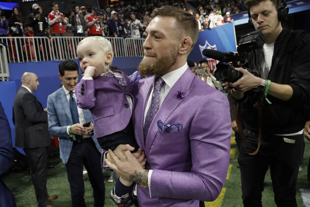 THIS CORRECTS FROM  CONNER TO CONOR: UFC Champion Conor McGregor enters the field, before the NFL Super Bowl 53 football game between the Los Angeles Rams and the New England Patriots Sunday, Feb. 3, 2019, in Atlanta. (AP Photo/Lynne Sladky)