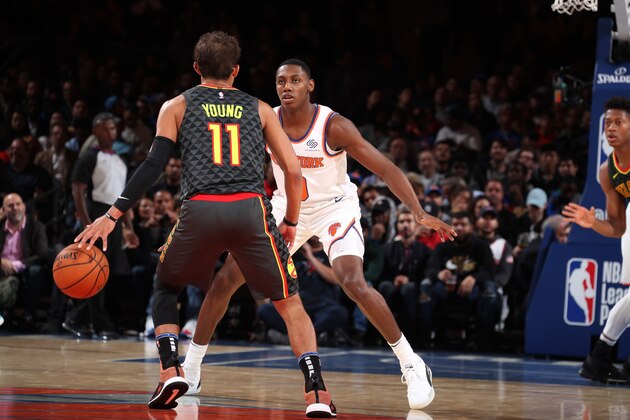 NEW YORK, NY - OCTOBER 16:  RJ Barrett #9 of the New York Knicks plays defense against Trae Young #11 of the Atlanta Hawks during a pre-season game on October 16, 2019 at Madison Square Garden in New York City, New York.  NOTE TO USER: User expressly acknowledges and agrees that, by downloading and or using this photograph, User is consenting to the terms and conditions of the Getty Images License Agreement. Mandatory Copyright Notice: Copyright 2019 NBAE  (Photo by Nathaniel S. Butler/NBAE via Getty Images)