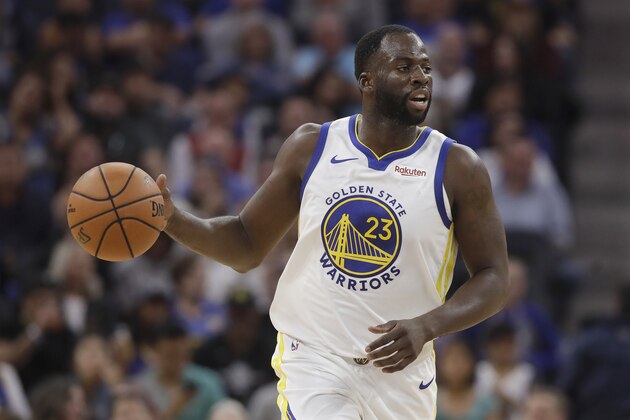 FILE - In this Oct. 5, 2019, file photo, Golden State Warriors forward Draymond Green dribbles against the Los Angeles Lakers during the first half of a preseason NBA basketball game in San Francisco. Stephen Curry knows how different this season will be. He realizes how many aren't even considering the Golden State Warriors a for-sure contender following five straight trips to the NBA Finals. Draymond Green received a $100 million, four-year extension, while Klay Thompson stayed put on a $190 million deal spanning the next five years. (AP Photo/Jeff Chiu, File)