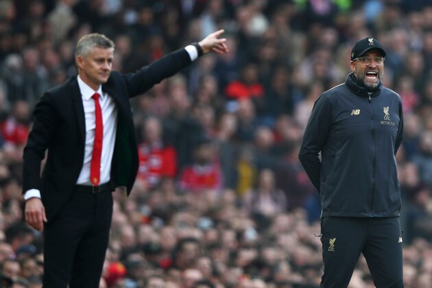 MANCHESTER, ENGLAND - FEBRUARY 24:  Jurgen Klopp, Manager of Liverpool and Ole Gunnar Solskjaer, Interim Manager of Manchester United react during the Premier League match between Manchester United and Liverpool FC at Old Trafford on February 24, 2019 in Manchester, United Kingdom.  (Photo by Clive Brunskill/Getty Images)