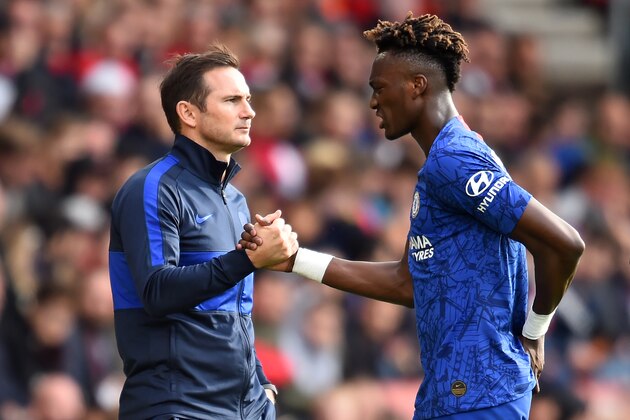 Chelsea's English head coach Frank Lampard (L) shakes hands with Chelsea's English striker Tammy Abraham as he's substituted during the English Premier League football match between Southampton and Chelsea at St Mary's Stadium in Southampton, southern England on October 6, 2019. (Photo by Glyn KIRK / AFP) / RESTRICTED TO EDITORIAL USE. No use with unauthorized audio, video, data, fixture lists, club/league logos or 'live' services. Online in-match use limited to 120 images. An additional 40 images may be used in extra time. No video emulation. Social media in-match use limited to 120 images. An additional 40 images may be used in extra time. No use in betting publications, games or single club/league/player publications. /  (Photo by GLYN KIRK/AFP via Getty Images)