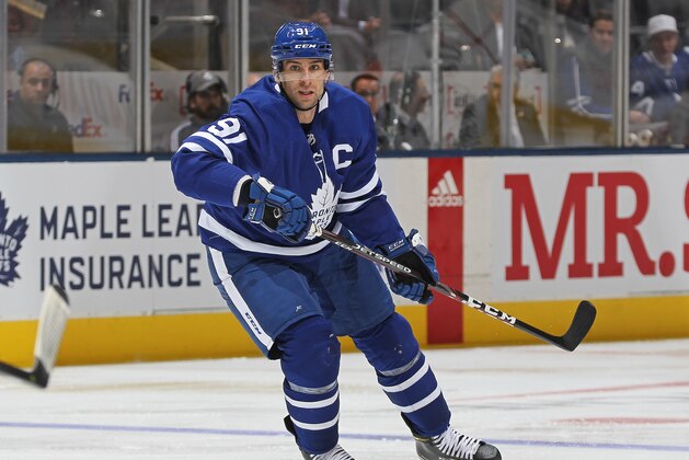 TORONTO, ON - OCTOBER 15:  John Tavares #91 of the Toronto Maple Leafs chases after the puck against the Minnesota Wild during an NHL game at Scotiabank Arena on October 15, 2019 in Toronto, Ontario, Canada. (Photo by Claus Andersen/Getty Images)