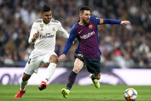 MADRID, SPAIN - FEBRUARY 27: Casemiro of Real Madrid competes for the ball with Lionel Messi of Barcelona during the Copa del Rey Semi Final second leg match between Real Madrid and FC Barcelona at Santiago Bernabeu on February 27, 2019 in Madrid, Spain. (Photo by Quality Sport Images/Getty Images)