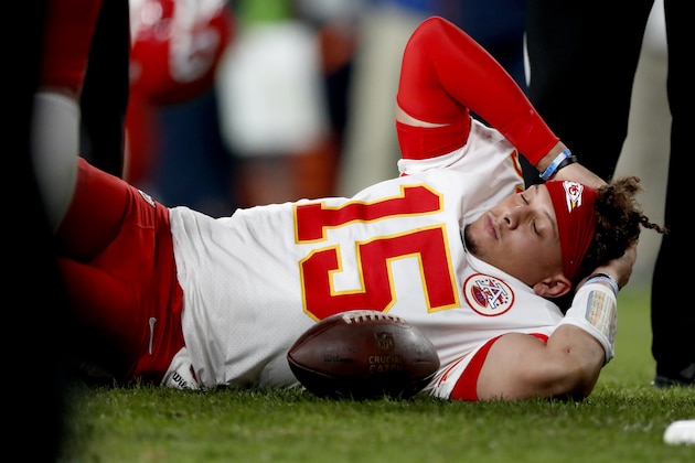 Kansas City Chiefs quarterback Patrick Mahomes (15) lies on the field after being injured against the Denver Broncos during the first half of an NFL football game, Thursday, Oct. 17, 2019, in Denver. (AP Photo/David Zalubowski)