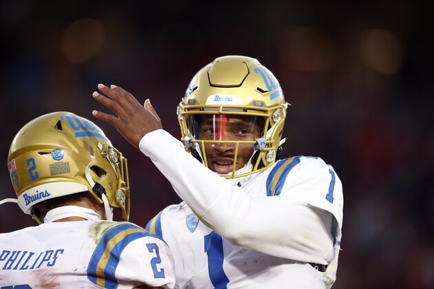 PALO ALTO, CALIFORNIA - OCTOBER 17:   Dorian Thompson-Robinson #1 of the UCLA Bruins congratulates Kyle Philips #2 after Philips caught a touchdown pass against the Stanford Cardinal at Stanford Stadium on October 17, 2019 in Palo Alto, California. (Photo by Ezra Shaw/Getty Images)