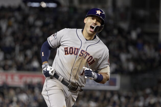 Houston Astros shortstop Carlos Correa (1) reacts as he rounds the bases after hitting a three-run home run against the New York Yankees during the sixth inning of Game 4 of baseball's American League Championship Series, Thursday, Oct. 17, 2019, in New York. (AP Photo/Frank Franklin II)